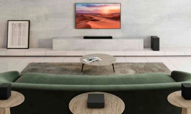 A LG soundbar in a living room under a TV.